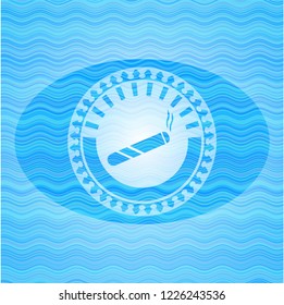joint, cigarette icon inside sky blue water emblem.