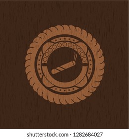 joint, cigarette icon inside vintage wooden emblem