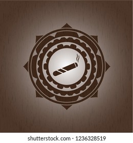 joint, cigarette icon inside wood badge or emblem