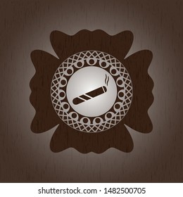 joint, cigarette icon inside wooden emblem
