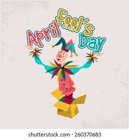 Joker popping out of gift box. April Fool's Day. Vector illustration