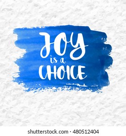 "Joy is a Choice" quote over a blue watercolor brush wash. Inspirational saying. Vector EPS-10 file, transparency used. 