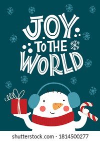 Joy to the world. Snowman in a hat with a gift. Great lettering for greeting cards, stickers, banners, prints and home interior decor. Xmas card. Merry Christmas and Happy new year 2021.