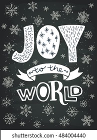 'Joy to the world' unique hand lettering on chalkboard background. Vector art. Great design element for greeting cards, banners and holidays flyers.