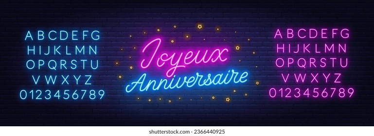 Joyeux Anniversaire neon lettering on brick wall background. Happy Birthday in French