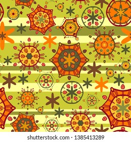 Joyful abstract pattern. Bright seamless vector with different orange, yellow and green elements on a light green background with green horizontal stripes. Items scattered randomly. For textiles