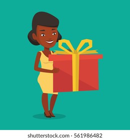 Joyful african-american woman holding a box with gift in hands. Happy woman holding gift box. Young woman standing with gift box. Girl buying a present. Vector flat design illustration. Square layout.
