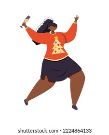 A joyful american woman in a christmas sweater jumps with a glass of champagne in her hand.