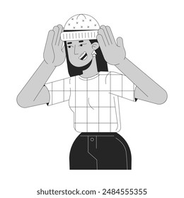 Joyful arab woman wearing warm hat black and white 2D line cartoon character. Middle eastern female trying on accessory isolated vector outline person. Fashion monochromatic flat spot illustration