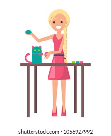 Joyful blonde girl with cute handicraft kitten vector illustration isolated on white backdrop, girl in pink dress and shoes standing by table with cat