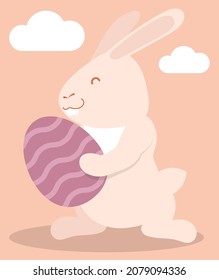 Joyful cheerful bunny, hare is holding festive Easter egg. Symbol of Easter holiday and year 2023 in Chinese calendar. Childrens vector illustration