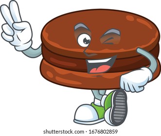 A joyful chocolate alfajor mascot design showing his two fingers