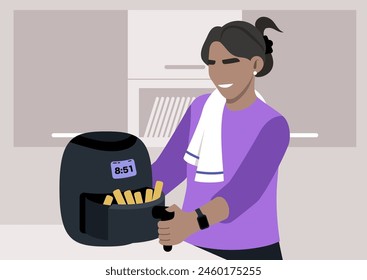 Joyful Cooking, A smiling woman checks on Crispy french fries in her air fryer in the kitchen