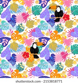 Joyful exotic seamless ornament with colorful tropical leaves, hibiscus flowers and toucans on the branches. Natural print for fabric.