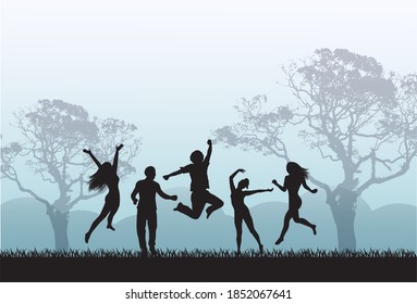 Joyful silhouettes of people jumping in the meadow against the background of mountains and trees