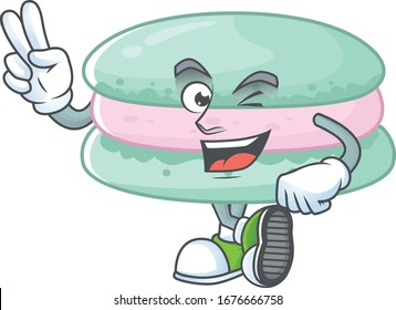 A joyful vanilla blue macarons mascot design showing his two fingers
