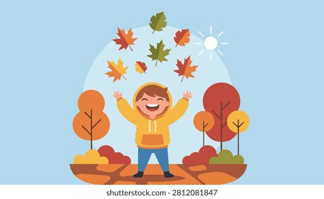 Joyful young boy throws colorful autumn maple leaves into the air on a beautiful bright sunny day in the park.