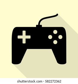 Joystick simple sign. Black icon with flat style shadow path on cream background.