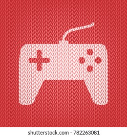 Joystick simple sign. Vector. Knitted white icon on a red knitted background.