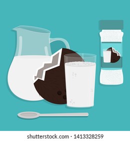 Jug of milk, cup of coconut milk and coconut powder packing. Spoon in front of the cup. Blue backgroung.
