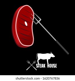 Juicy beef steak strung on a barbecue fork.