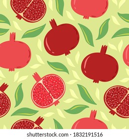 Juicy fruit seamless pomegranate pattern with leaves on a light green background. Flat vector illustration.