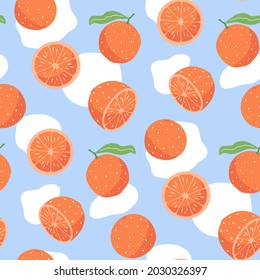 Juicy grapefruits pattern. Hand drawn vector illustration isolated on a blue background.