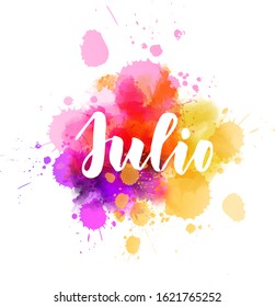 Julio (July in Spanish) -  handwritten modern calligraphy lettering on abstract watercolor imitation splash. 