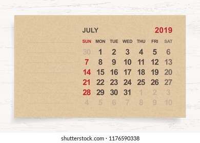 July 2019 - Monthly calendar on brown paper and wood background with area for note. Vector illustration.