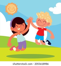 jumping girl and boy on grass