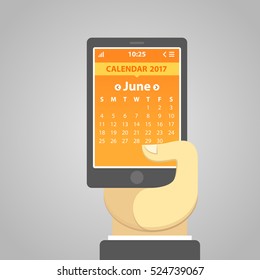 June 2017, weeks start from Sunday. Vector illustration of a smartphone holding in a hand, with a calendar on the screen. Simple user interface in flat design