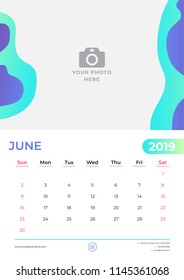June 2019 calendar design. Simple green and purple background. Week starts on Sunday. Vector design print template with place for photo. 