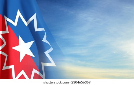 The Juneteenth flag on background of sky. Juneteenth is a federal holiday in the United States commemorating the emancipation of enslaved African-Americans. EPS10 vector