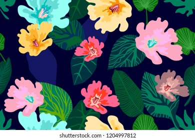 Jungle print with blooming flowers. Seamless vector pattern with palm leaves and tropical plants. Aloha textile collection. On dark blue background.