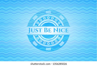 Just Be Nice sky blue water wave style emblem.