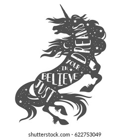 Just believe in your dreams. Magic unicorn silhouette with quote.  Beautiful fantasy print for t-shirt design.  Inspirational and motivational vector