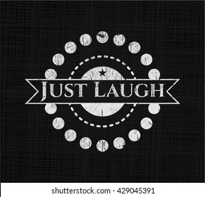 Just Laugh written on a blackboard