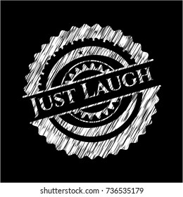 Just Laugh written on a chalkboard