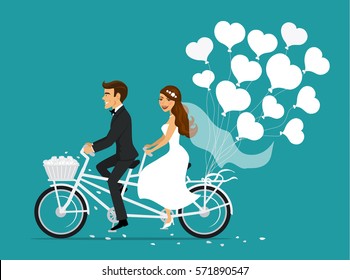 Just married couple bride and groom riding tandem bicycle 