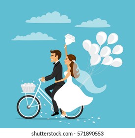 Just married happy couple bride and groom riding bicycle with balloons