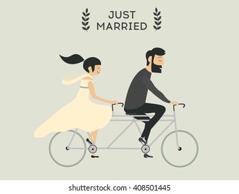 Just married wedding couple riding bicycle
