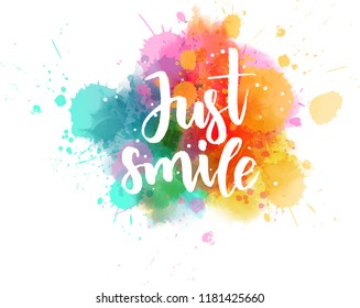 Just smile - handwritten modern calligraphy lettering on colorful watercolor splash