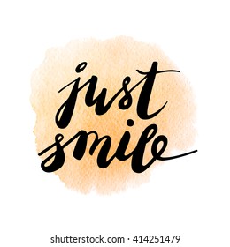 Just smile. Inspirational quote handwritten on orange watercolor background. Vector lettering. Good vibes.