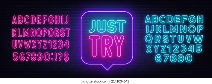 Just Try neon sign in the speech bubble on brick wall background.