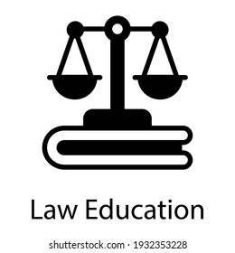 Justice scale and book denoting solid icon of law education