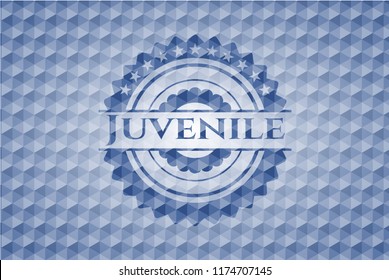 Juvenile blue badge with geometric pattern.