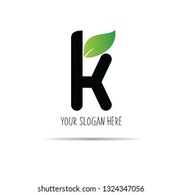 k black initial letter logo simple with green leaf 11