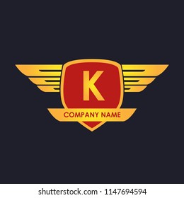 K initial shield with wings gold color logo
