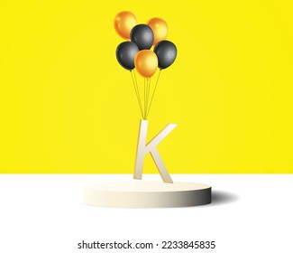 K letter design hanging with golden and black balloons
