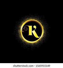 K letter golden icon in middle of golden sparking ring. K logo sign with empty center. Golden sparkling ring with dust glitter graphic on black background. Glorious decorative glowing shiny design.